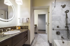 Combined shower/bathtub, designer toiletries, hair dryer, bathrobes