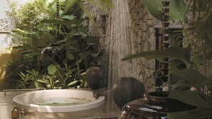 A garden with a water feature, including a fountain and a small pond. - Shangri-La Rasa Sayang, Penang (George Town)