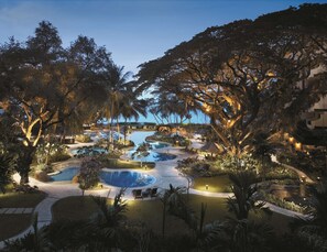 A resort with multiple swimming pools surrounded by lush vegetation and trees. - Shangri-La Rasa Sayang, Penang (George Town)