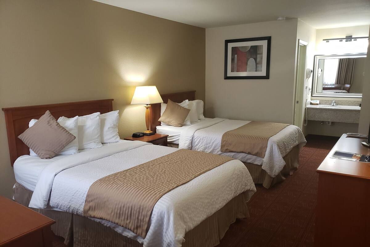 Standard Double Room, 2 Double Beds | Premium bedding, down comforters, blackout drapes, iron/ironing board