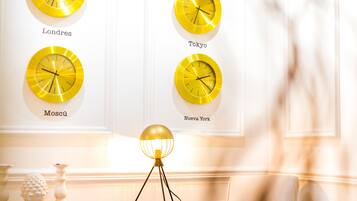 A wall with four clocks labeled with city names.