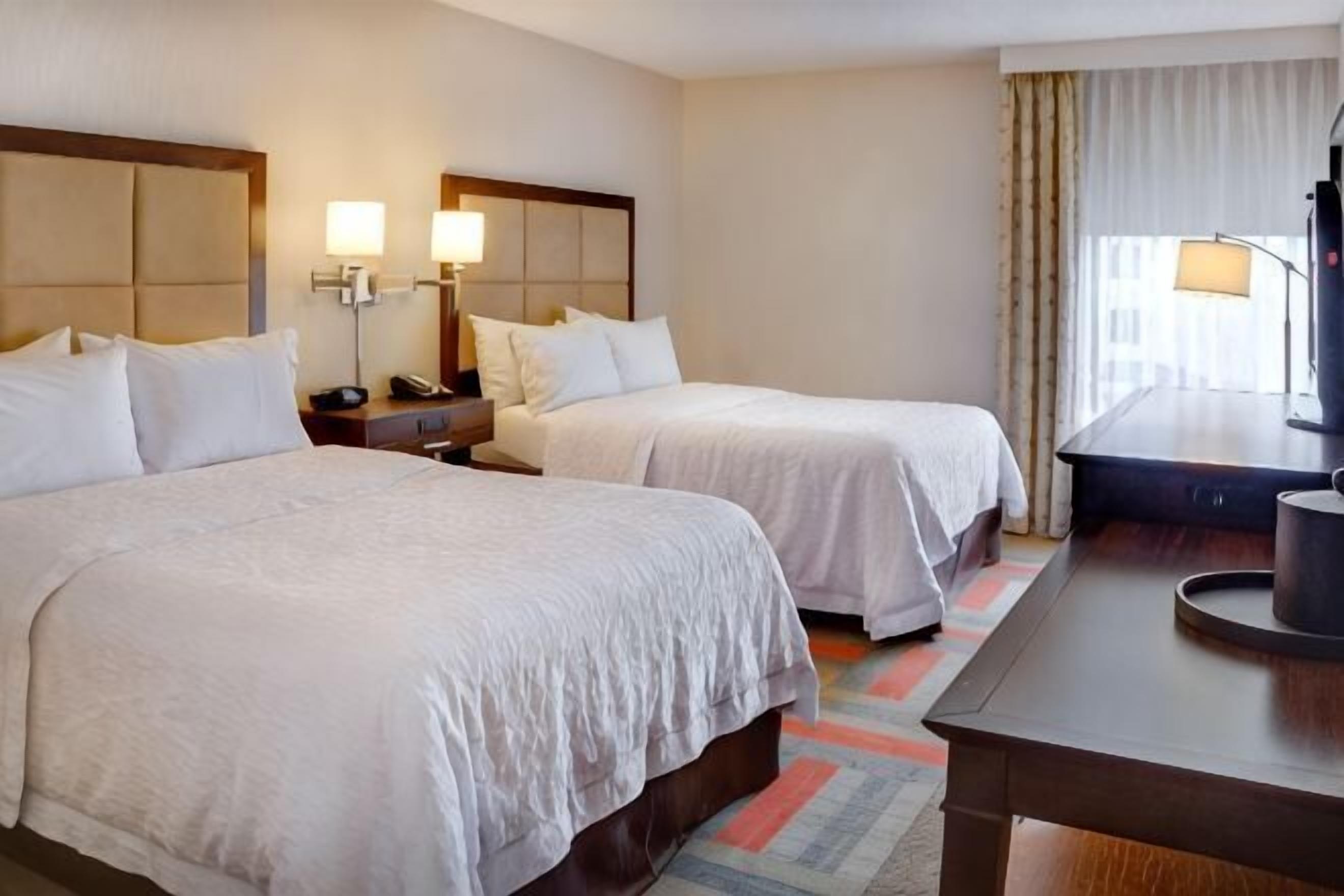 Premium bedding, desk, laptop workspace, iron/ironing board