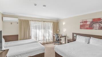 Medium Family Room, Multiple Beds | Laptop workspace, iron/ironing board, free WiFi, bed sheets
