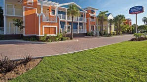 A hotel with a two-story structure, a covered outdoor area, and a well-maintained lawn. - Fairfield Inn and Suites by Marriott Key West (Key West)