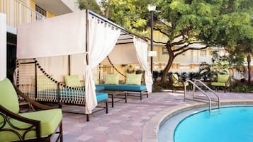 Outdoor pool, open 7:00 AM to 10:00 PM, free cabanas, sun loungers