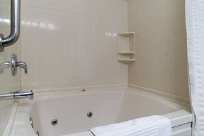 Suite, 1 King Bed, Jetted Tub | In-room safe, individually furnished, iron/ironing board