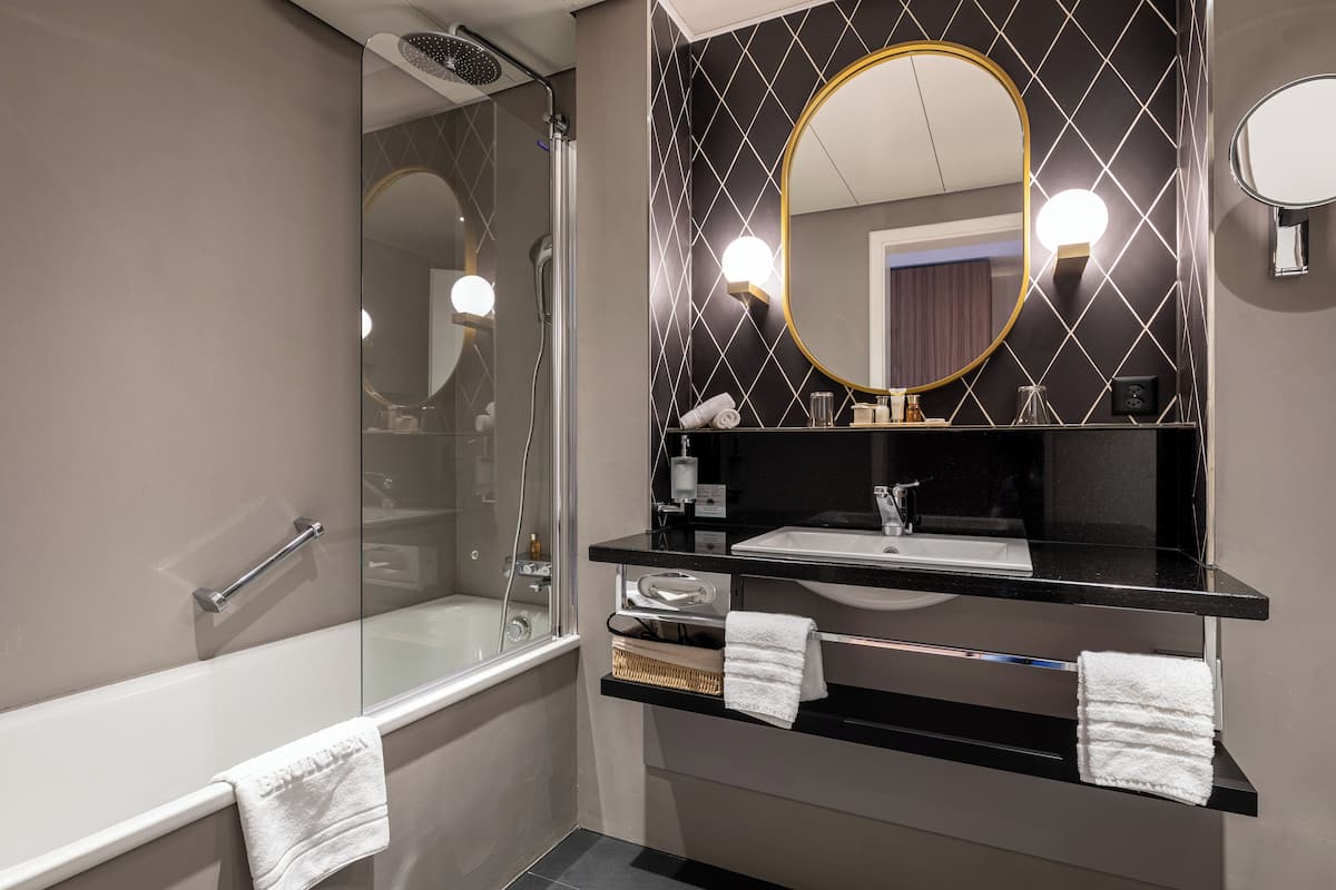 eco-friendly toiletries, hair dryer, slippers, towels