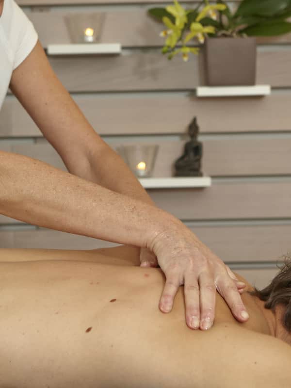 Experience a serene massage therapy session in a peaceful space with a skilled therapist.