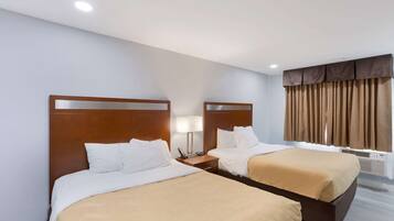 Premium bedding, down duvets, Tempur-Pedic beds, laptop workspace