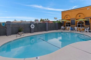 Seasonal outdoor pool, open 10:00 AM to 10 PM, pool umbrellas