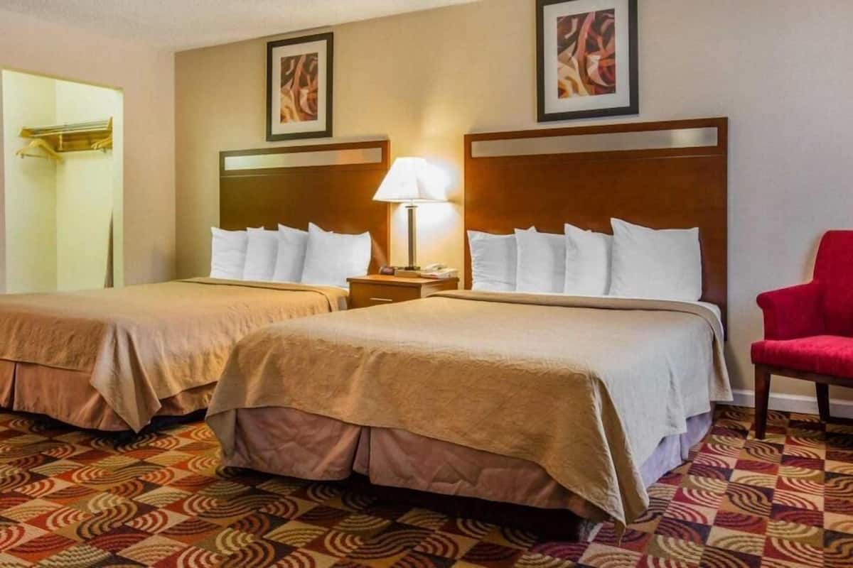 Premium bedding, down comforters, Tempur-Pedic beds, laptop workspace