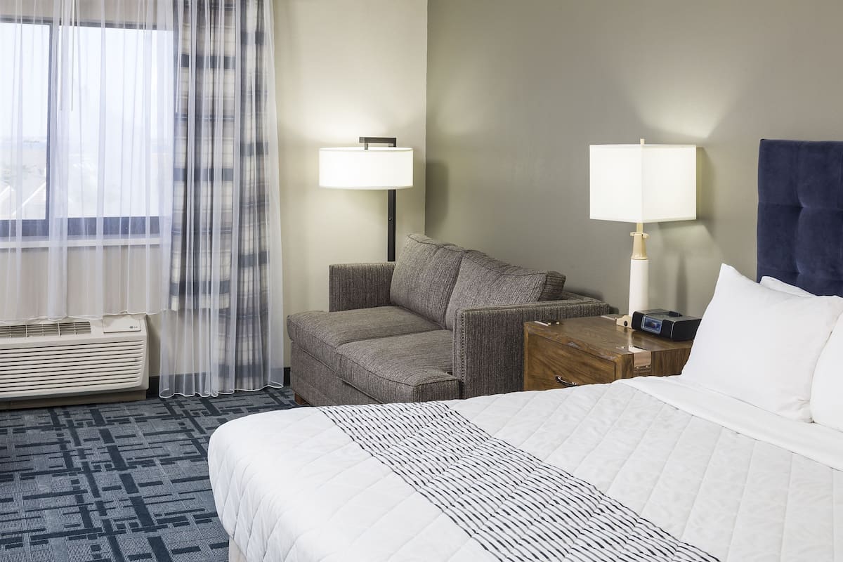 Hypo-allergenic bedding, desk, laptop workspace, blackout curtains