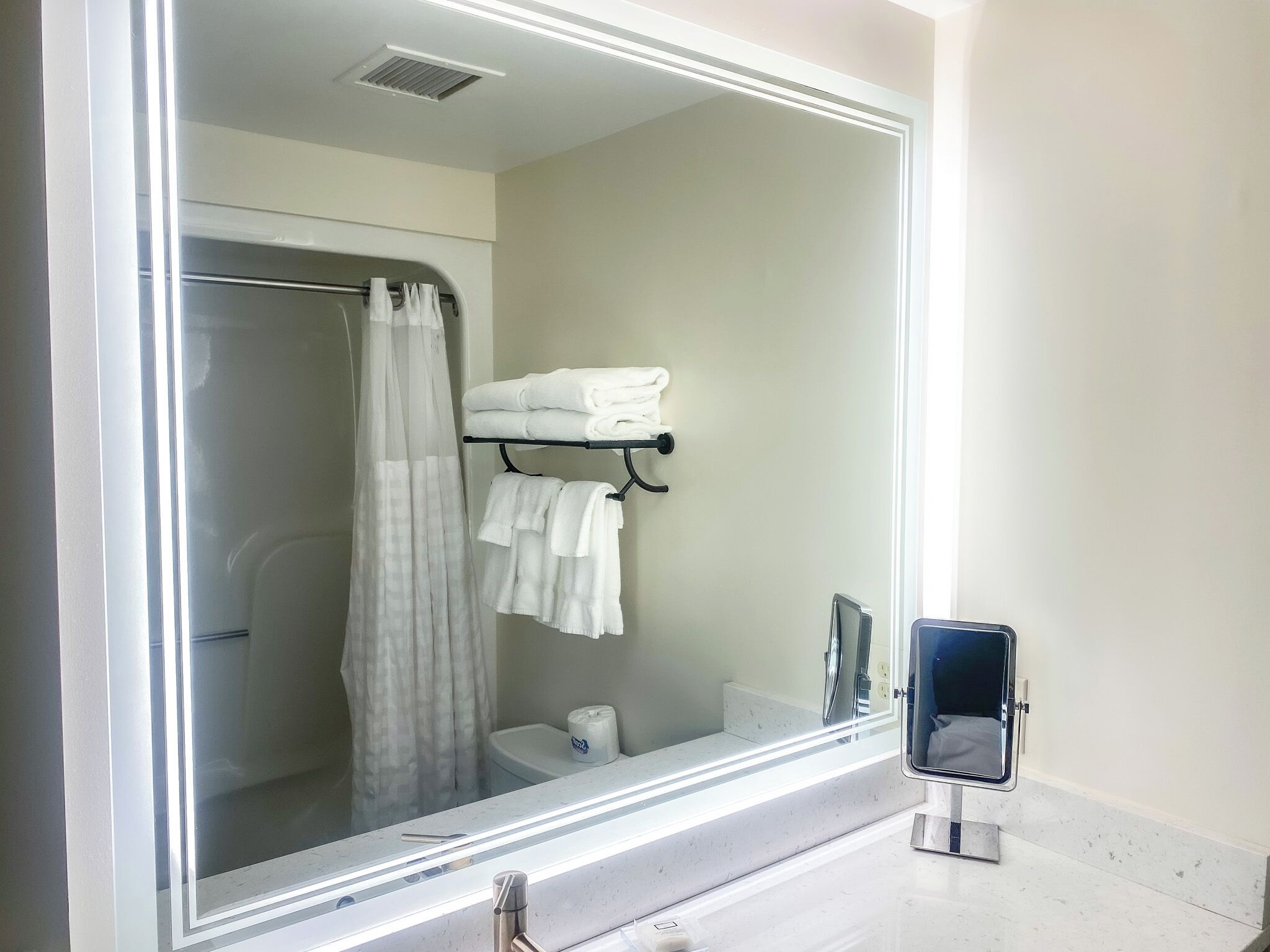 eco-friendly toiletries, hair dryer, towels