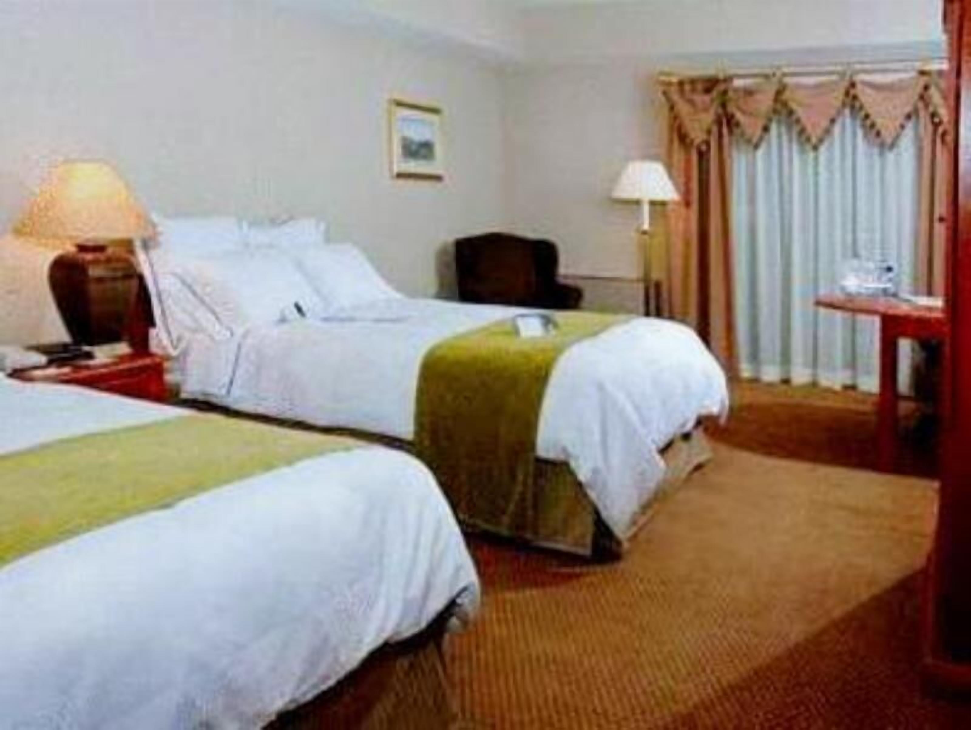 Hypo-allergenic bedding, desk, laptop workspace, blackout curtains