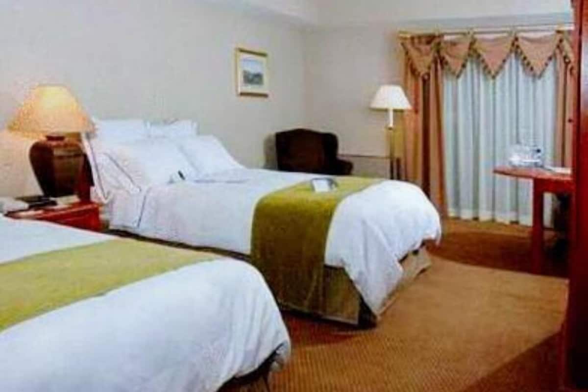 Hypo-allergenic bedding, desk, laptop workspace, blackout curtains