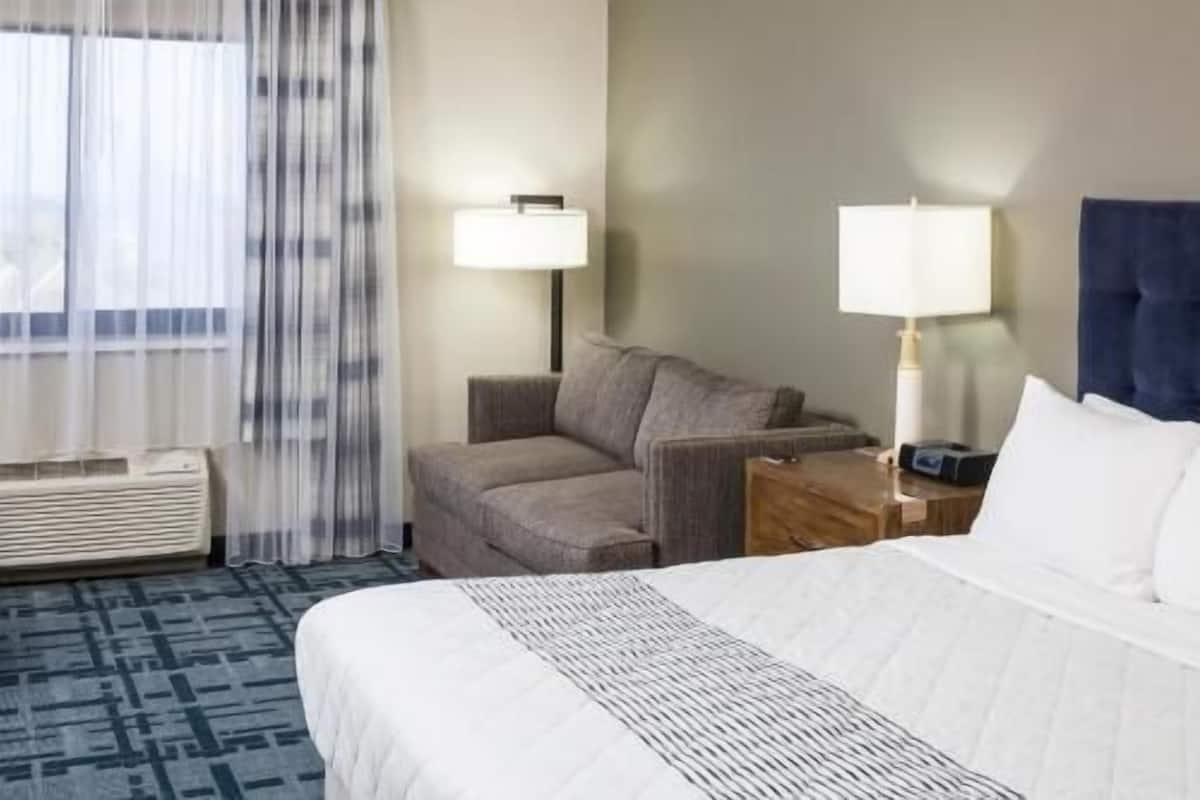 Hypo-allergenic bedding, desk, laptop workspace, blackout curtains