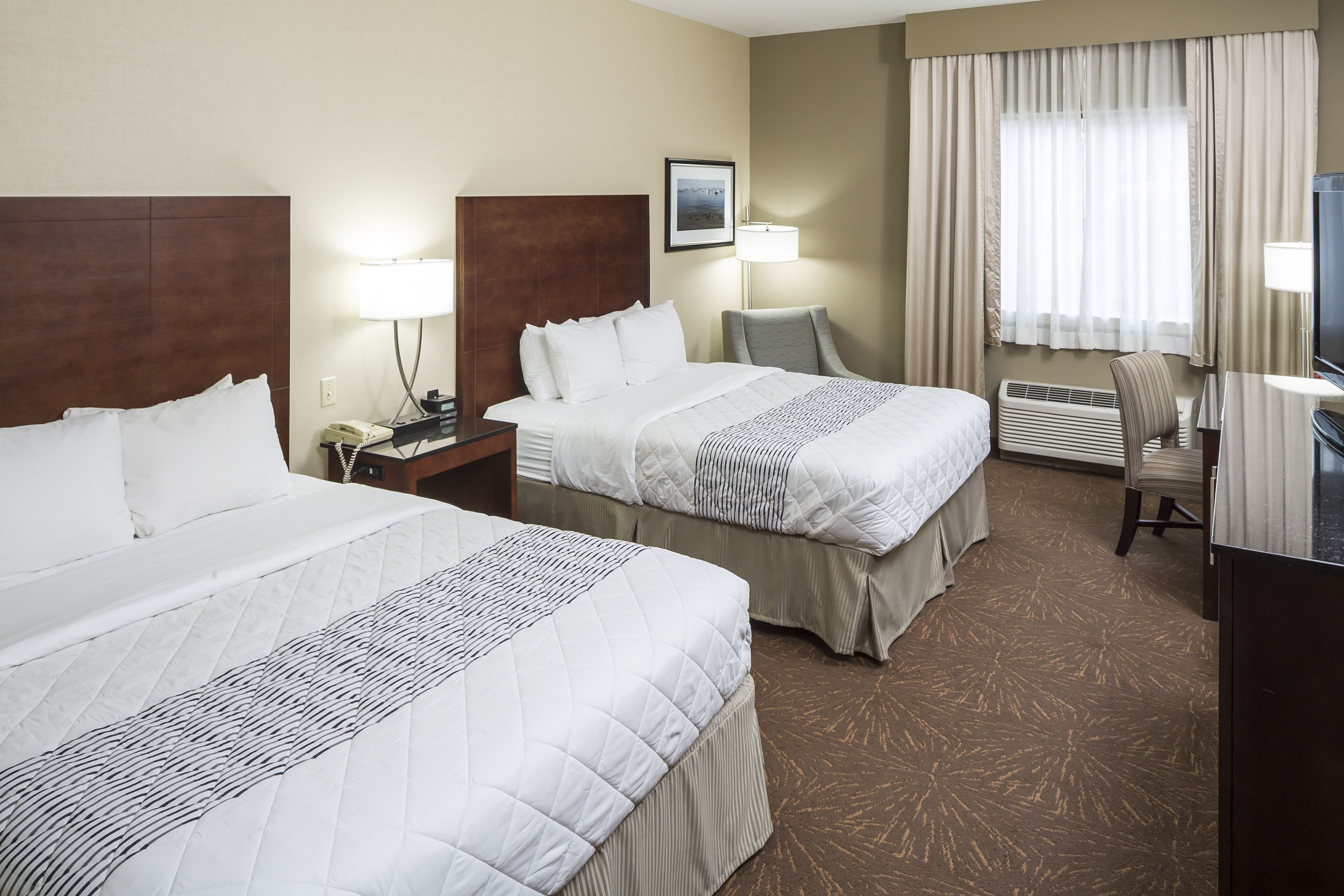 Hypo-allergenic bedding, desk, laptop workspace, blackout curtains