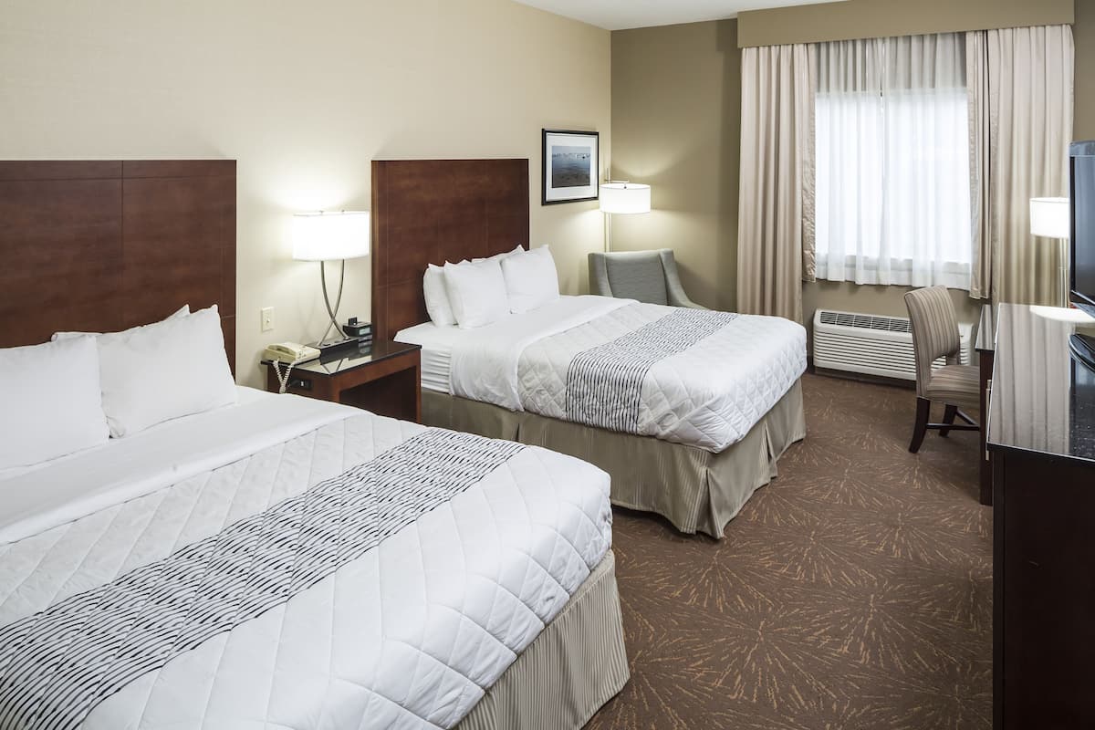 Hypo-allergenic bedding, desk, laptop workspace, blackout curtains