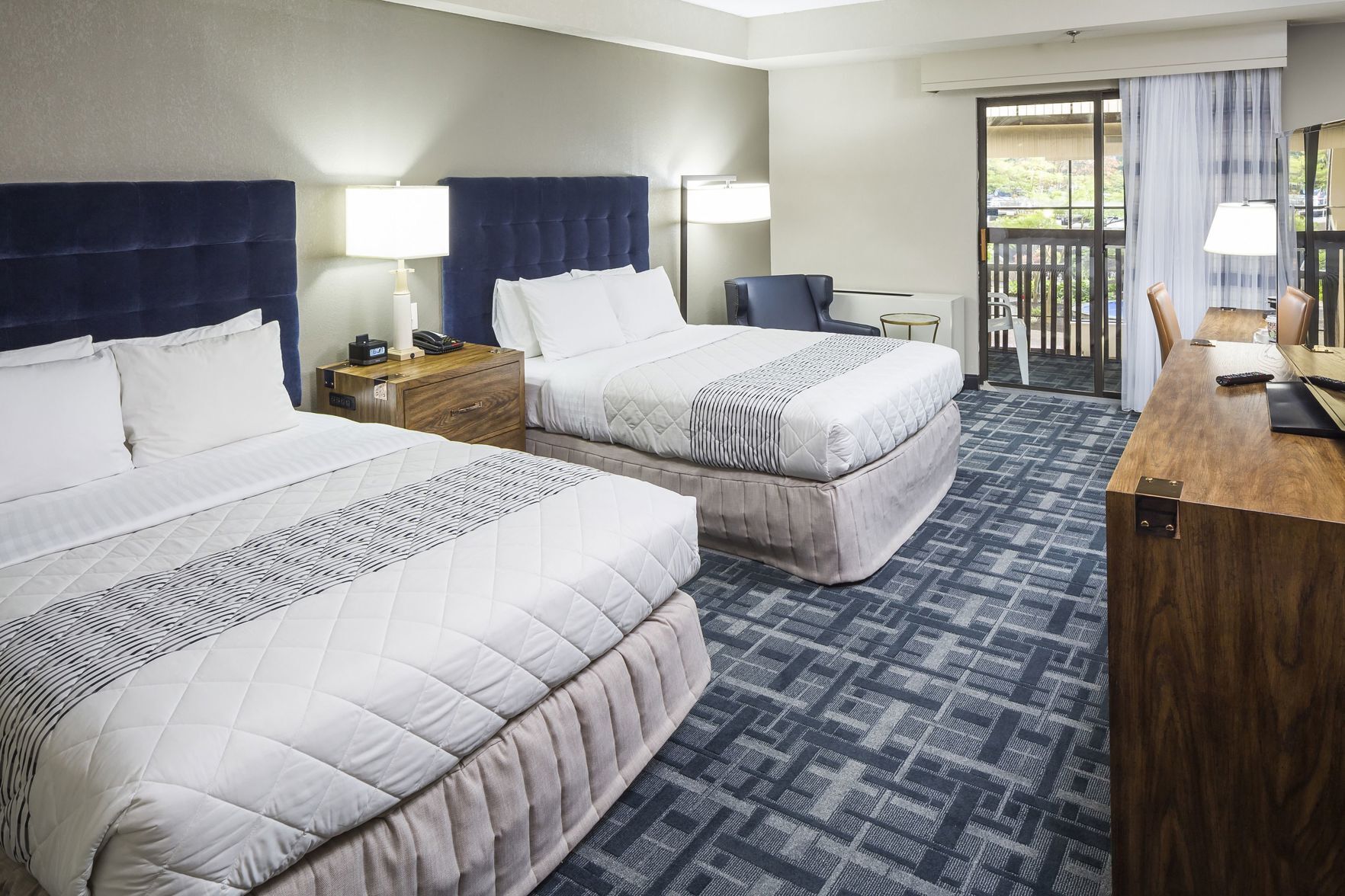 Hypo-allergenic bedding, desk, laptop workspace, blackout curtains