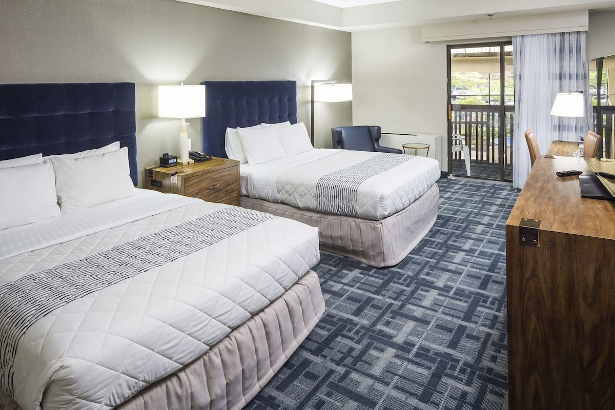 Hypo-allergenic bedding, desk, laptop workspace, blackout curtains