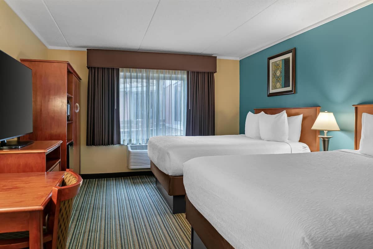 Premium bedding, pillow-top beds, blackout curtains, iron/ironing board