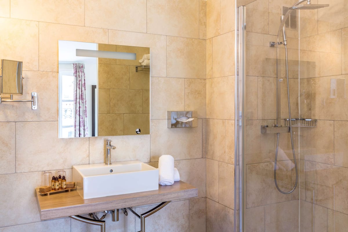 Superior Room, 1 Queen Bed, Non Smoking (Larger Room;Twin bed on request) | Bathroom | Combined shower/bathtub, eco-friendly toiletries, hair dryer, towels