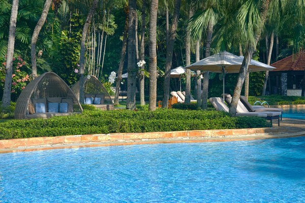 Outdoor pool, open 6:00 AM to 8:00 PM, free pool cabanas, pool umbrellas