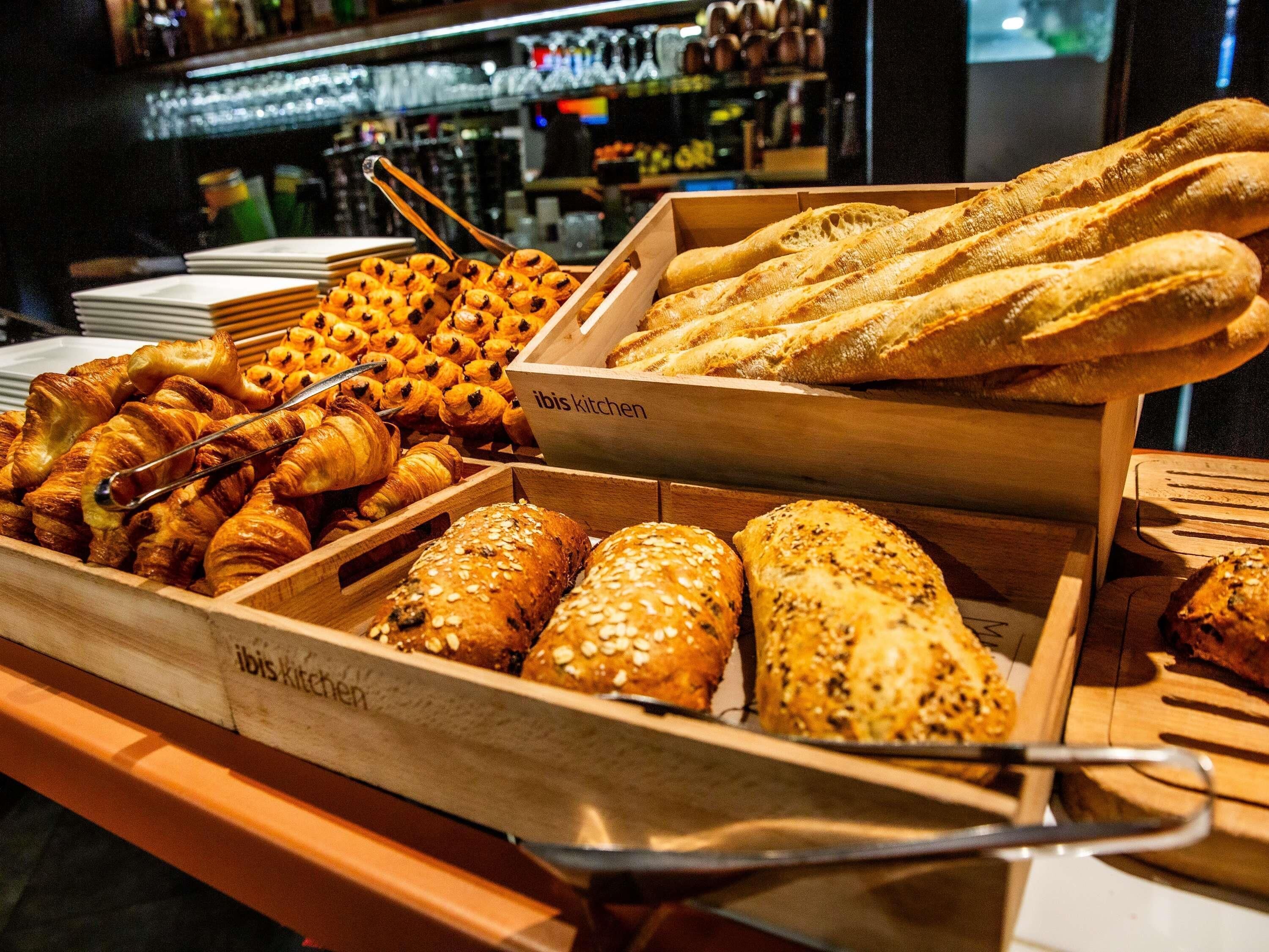A bakery display with various baked goods.