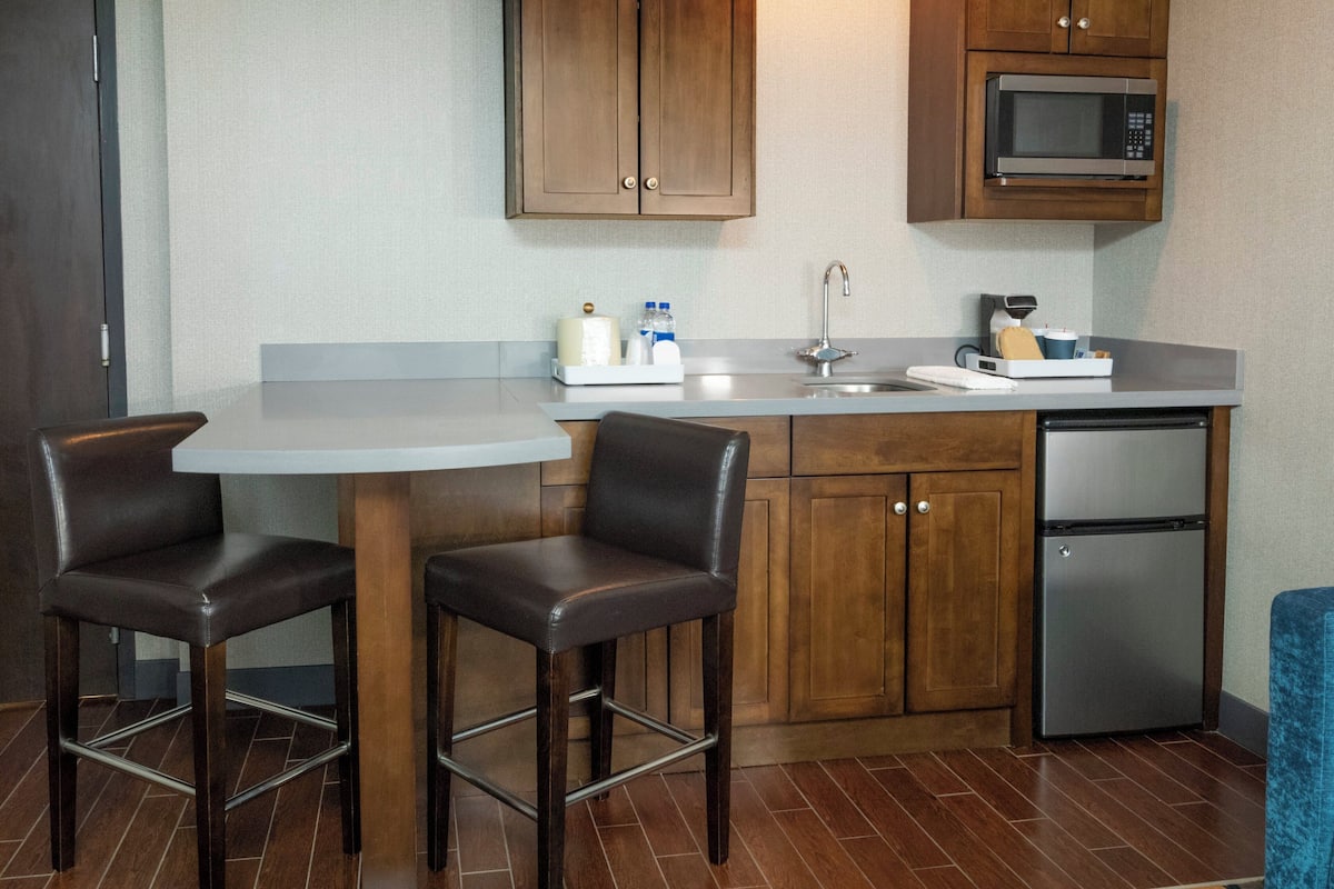 Hypo-allergenic bedding, down duvets, desk, laptop workspace