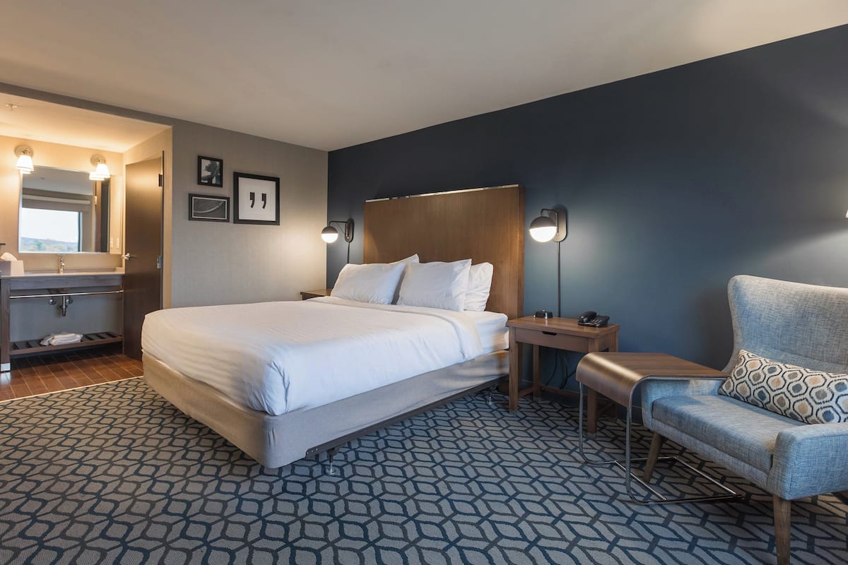 Hypo-allergenic bedding, down duvets, desk, laptop workspace