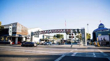 A street intersection with a large sign reading "JACK LONDON SO."