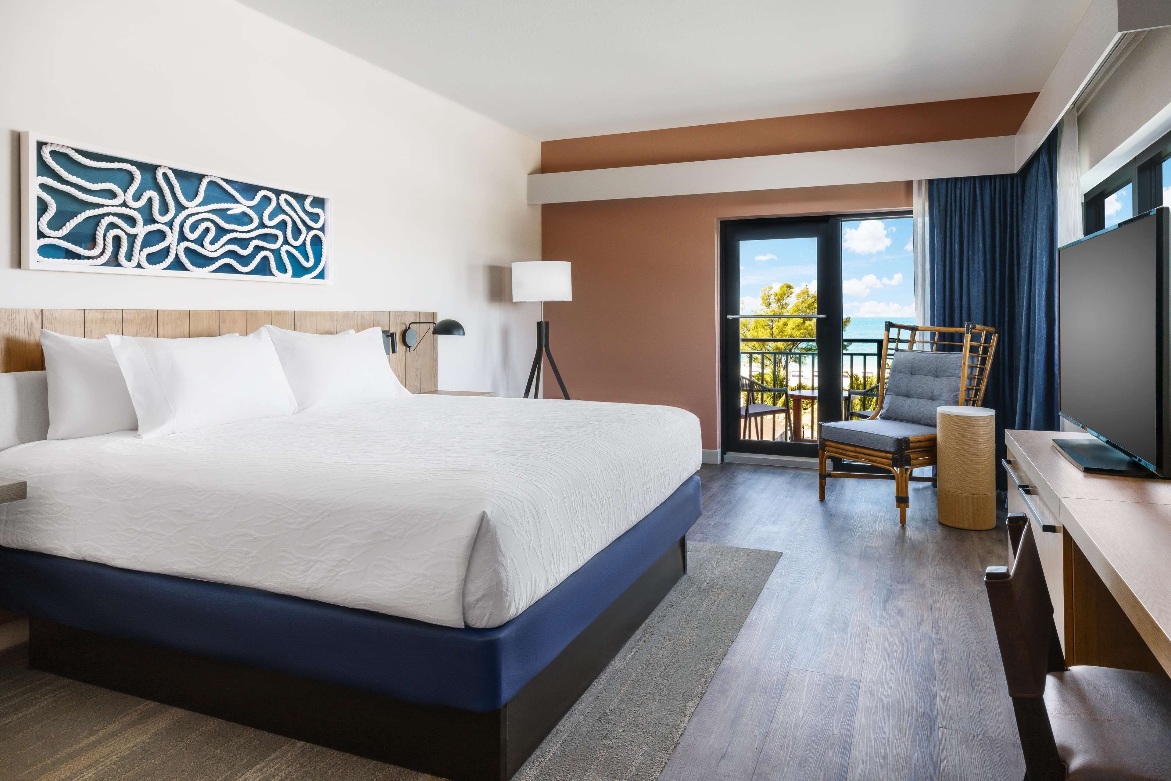 room, 1 king bed, corner (gulf view) | in-room safe, desk, blackout curtains, iron/ironing board