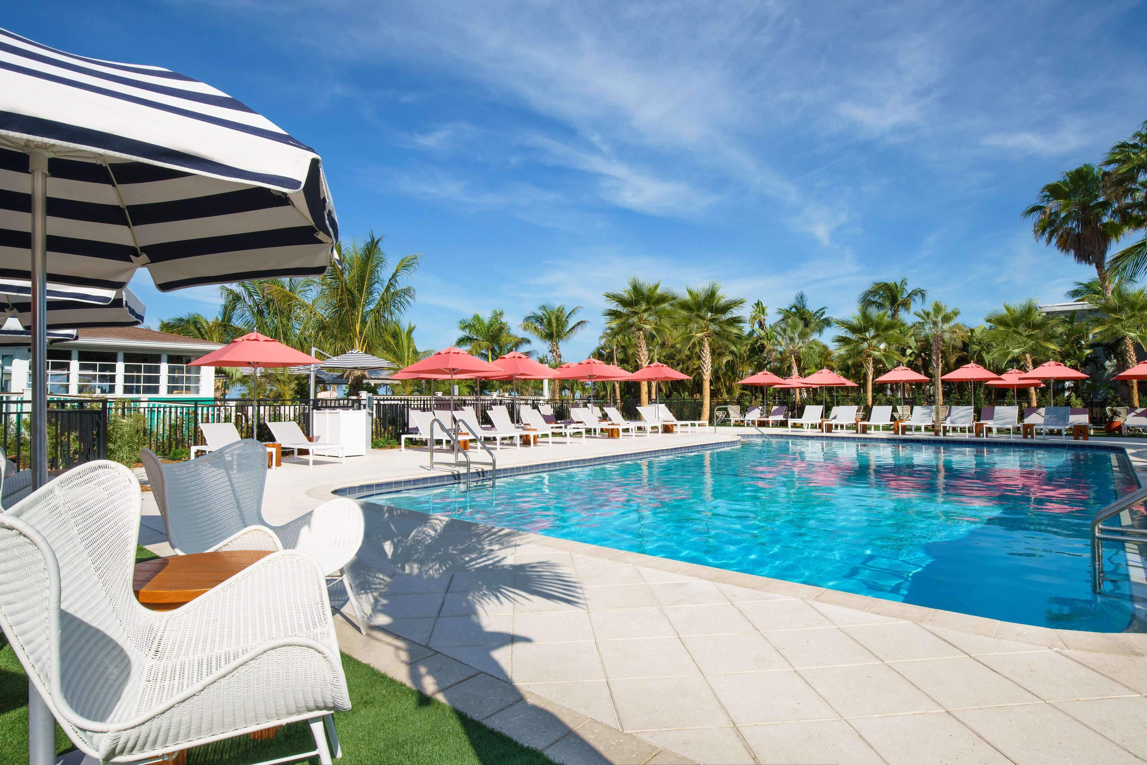 outdoor pool, open 8:00 am to 8:00 pm, pool umbrellas, pool loungers