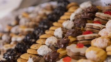 A variety of cookies and pastries on a tray.