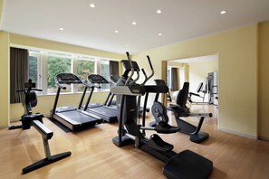 Stay fit on the go with our fully equipped fitness center featuring treadmills, elliptical trainers, and a weight machine.