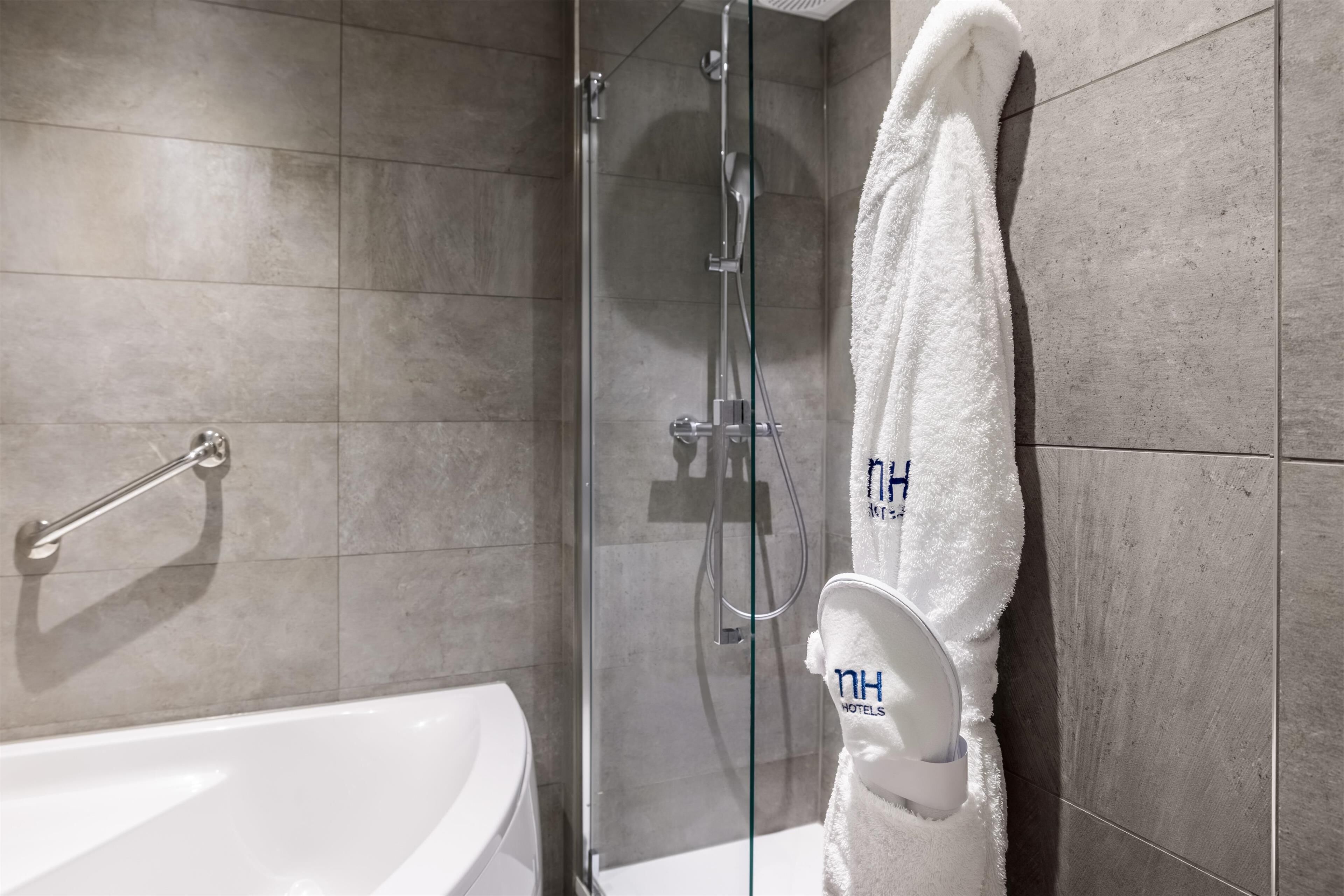 deep-soaking bathtub, rainfall showerhead, eco-friendly toiletries