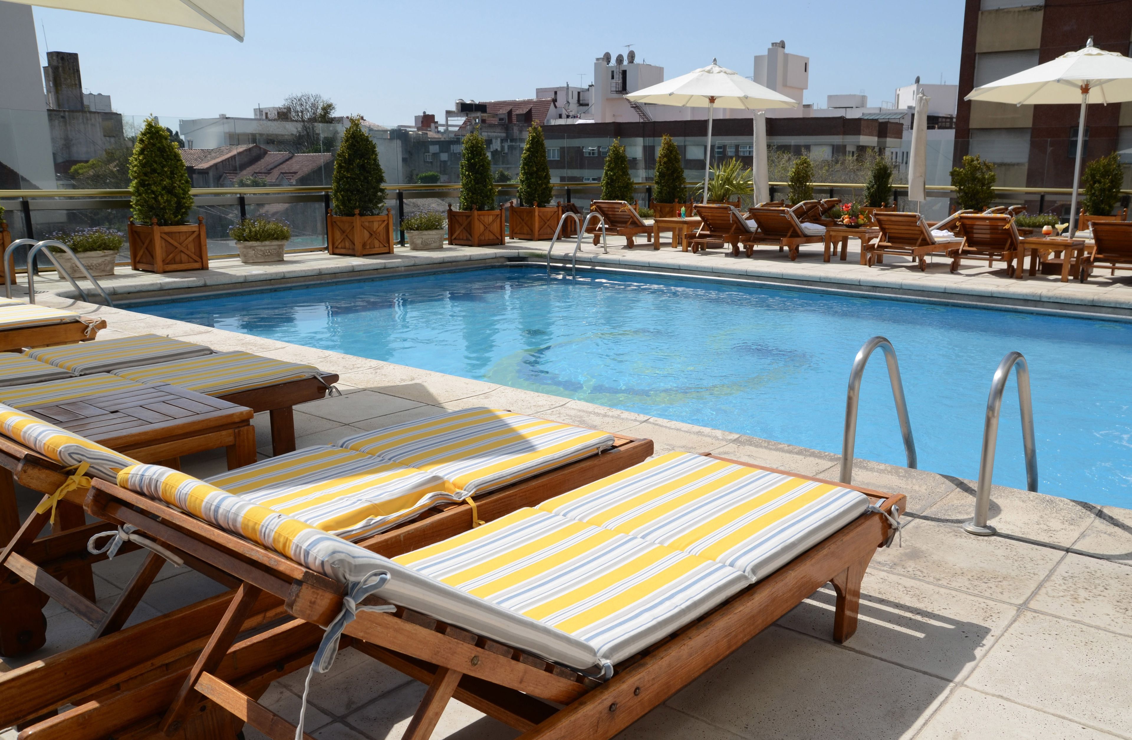 Indoor pool, outdoor pool, open 7:00 AM to 9:00 PM, pool umbrellas