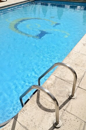 Indoor pool, outdoor pool, open 7:00 AM to 9:00 PM, pool umbrellas