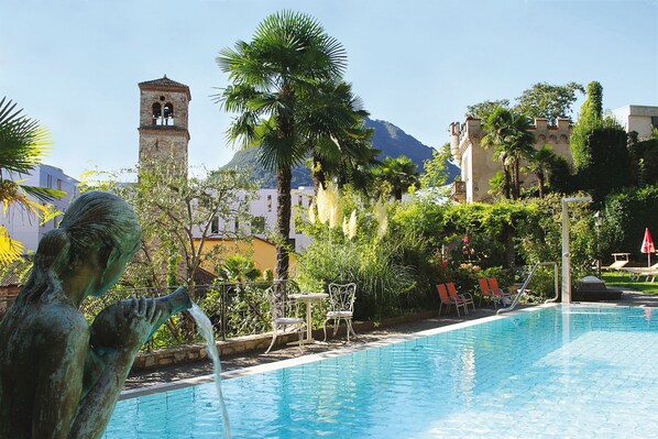 Seasonal outdoor pool, open 8:00 AM to 8:00 PM, pool umbrellas