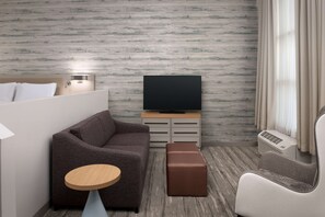 Junior Suite, One King Bed | Living area | 55-inch LCD TV with satellite channels, TV, MP3 dock