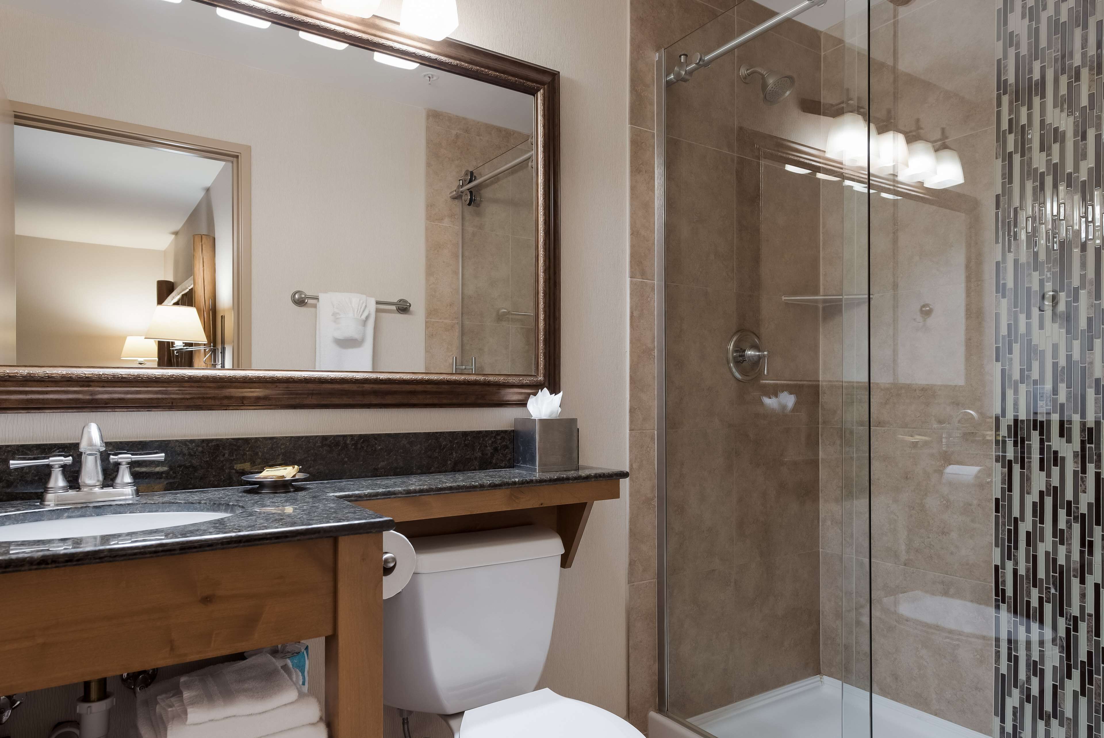 suite, 1 king bed, non smoking, balcony (larger room) | bathroom | combined shower/bathtub, free toiletries, hair dryer, towels