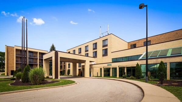 Stylish building with a central entrance and covered walkway.