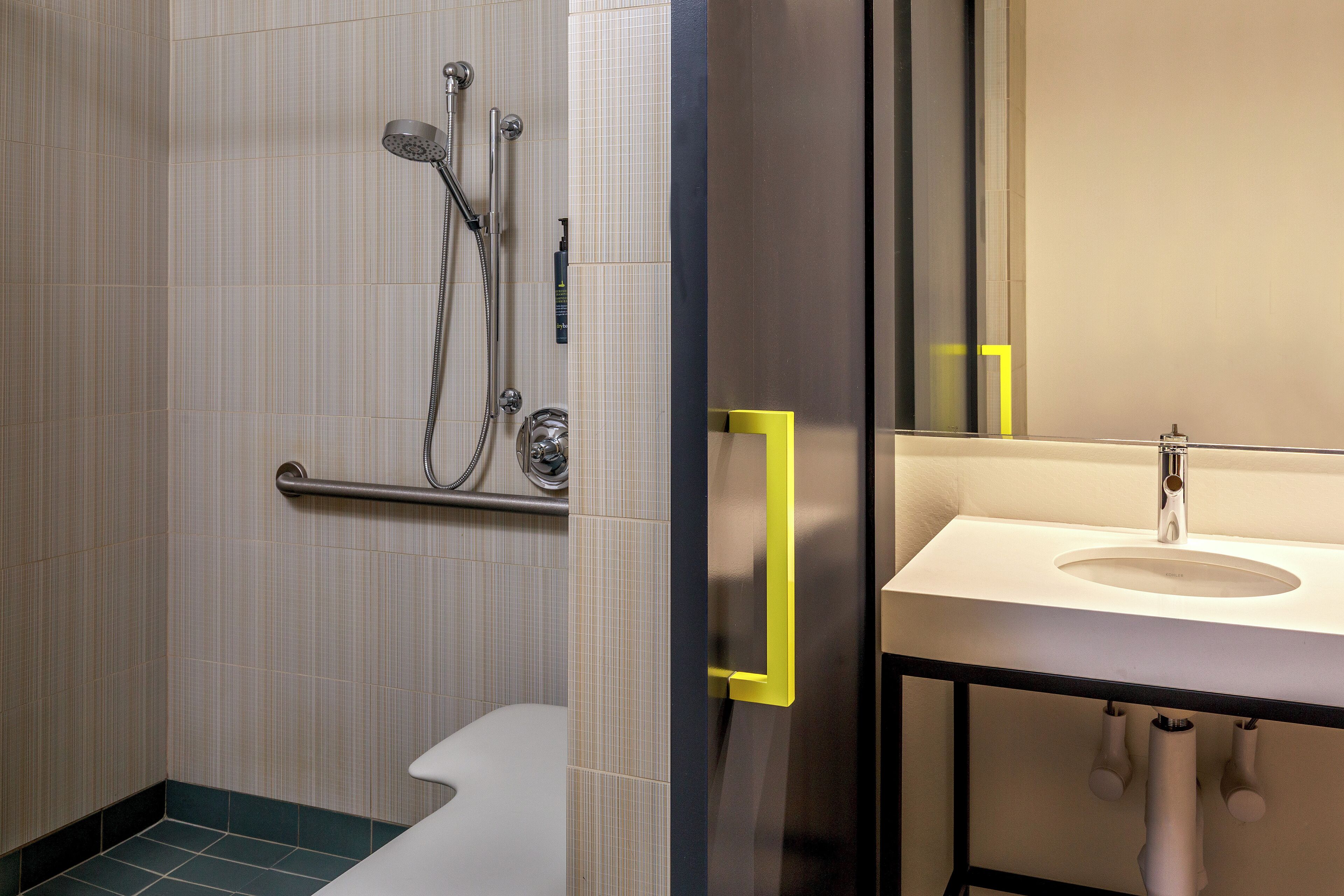 room, 1 king bed (mobility/hearing access, roll-in shwr) | bathroom | shower, eco-friendly toiletries, hair dryer, towels