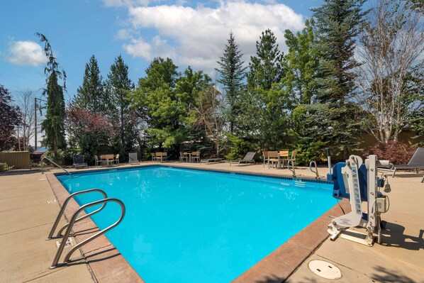 Relax by the pool surrounded by lush greenery and enjoy a refreshing swim.