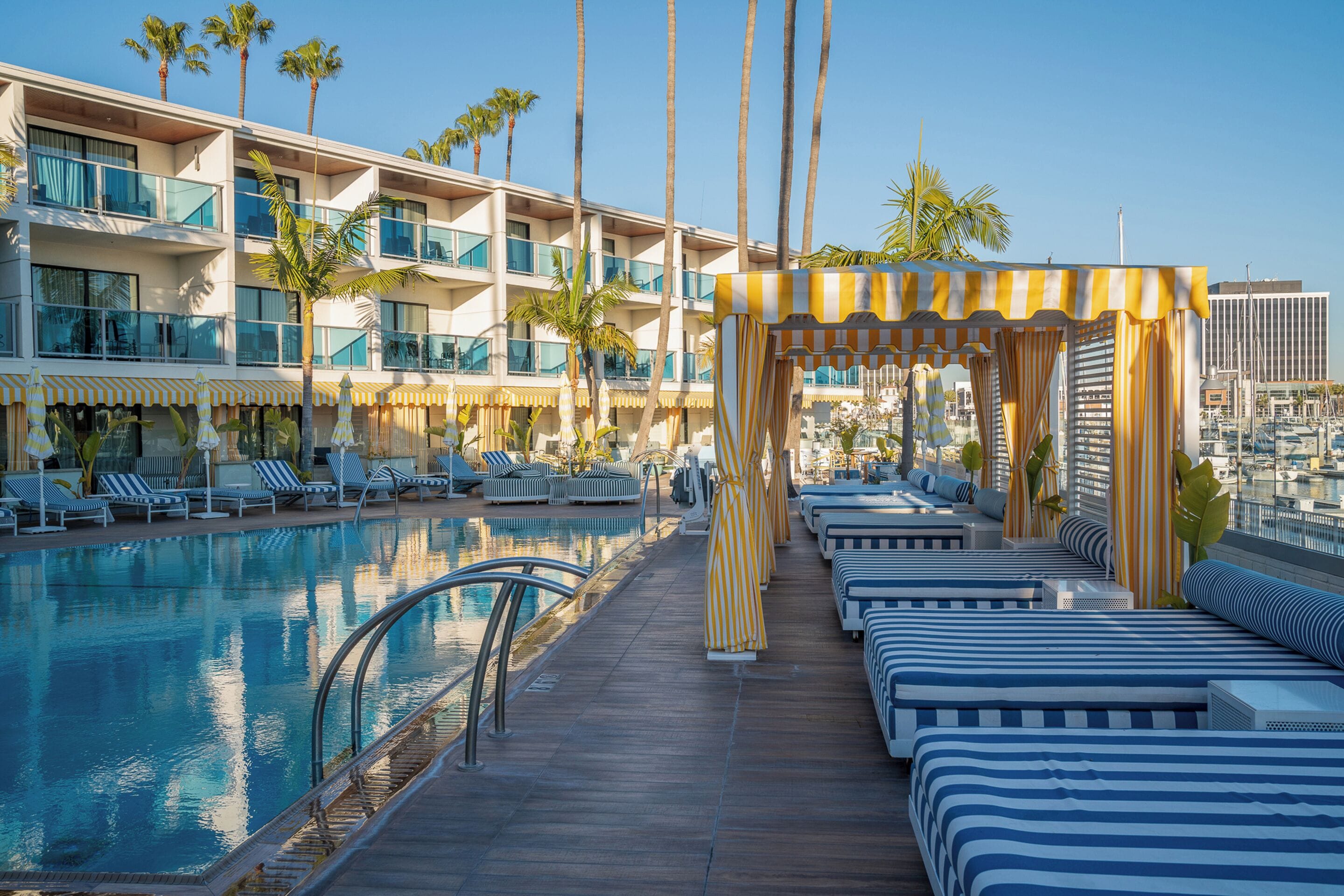 A poolside area with lounge chairs and a cabana.