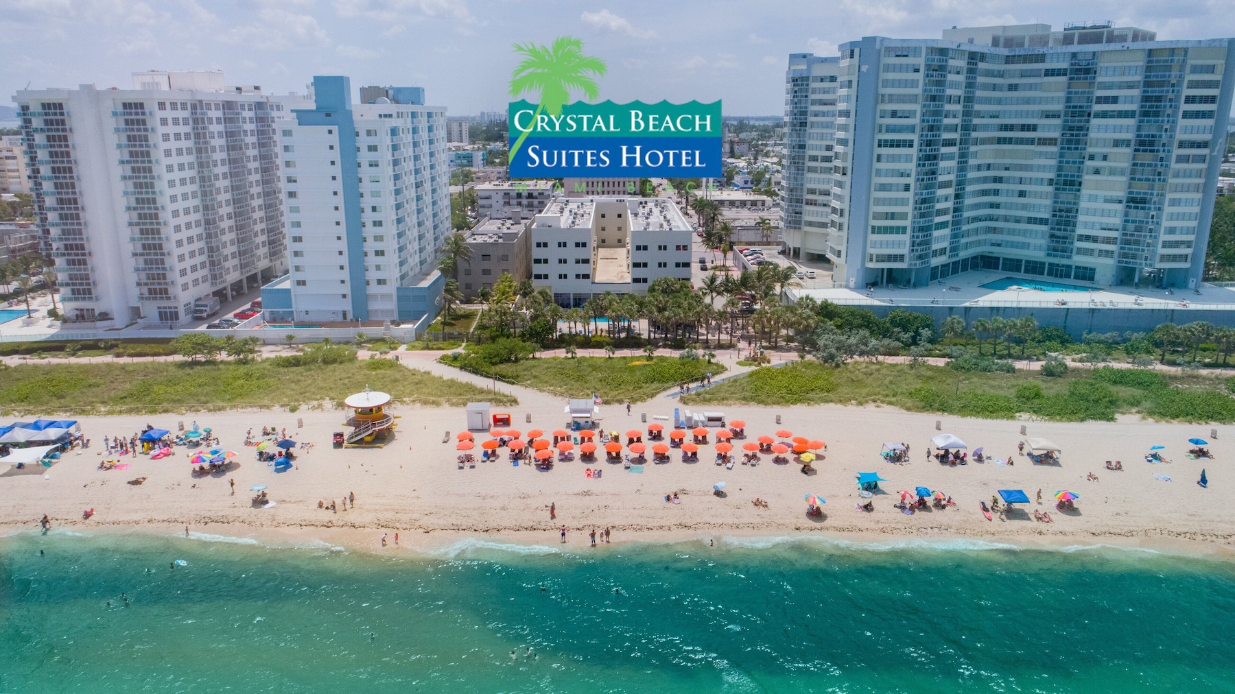 On the beach, white sand, sun loungers, beach towels