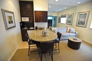 Premium King Suite | Private kitchenette | Mini-fridge, microwave, stovetop, dishwasher at Crystal Beach Suites Miami Oceanfront Hotel