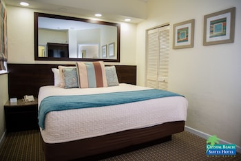 Premium King Suite (Renovated/Top Floor) | In-room safe, laptop workspace, blackout drapes, iron/ironing board at Crystal Beach Suites Oceanfront Hotel