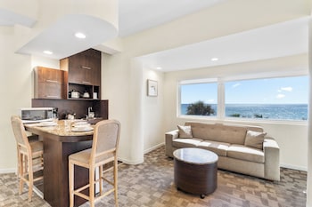 Oceanfront Queen Suite | Living area | 43-inch flat-screen TV with digital channels, TV at Crystal Beach Suites Miami Oceanfront Hotel