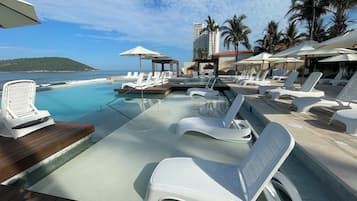 Outdoor pool, open 8:00 AM to 9:00 PM, pool umbrellas, sun loungers